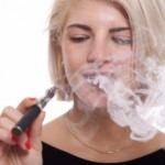 Young blonde smoking electronic cigarette: Smokedistrict Electronic Cigarettes Blog