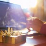 Man at work next to ashtray full of cigarettes: Smokestage Tobacco Cigarettes Blog