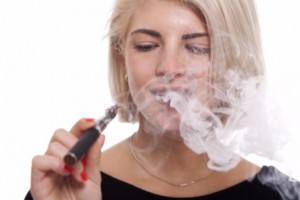 Young blonde smoking electronic cigarette: Smokedistrict Electronic Cigarettes Blog